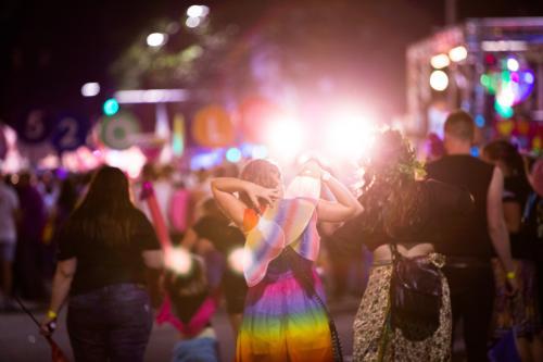 Girl dressed as fairy out at a dress up event at night - Australian Stock Image
