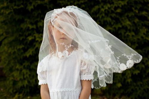 Girl in a communion veil