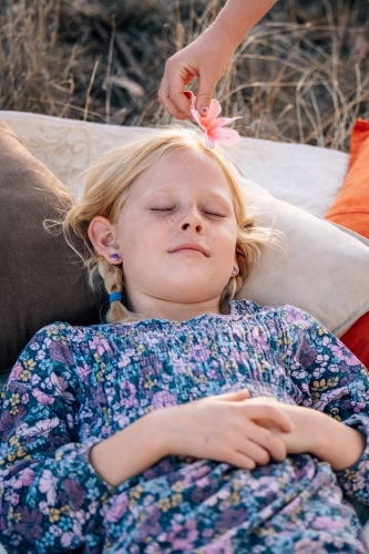 Girl laying down relaxing - Australian Stock Image