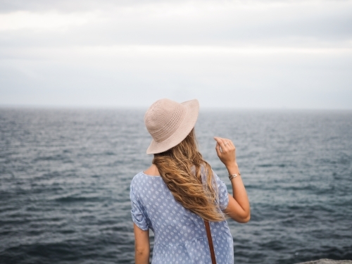 Girl looking out to ocean