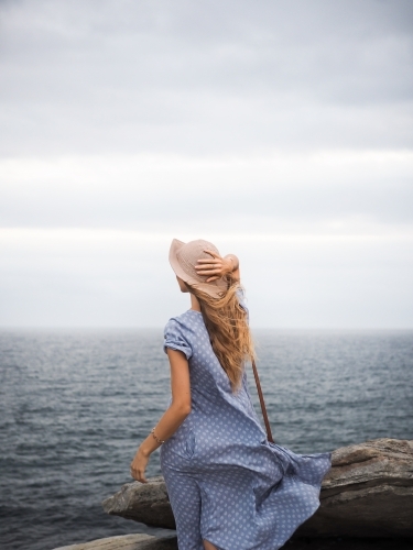 Girl looking out to ocean