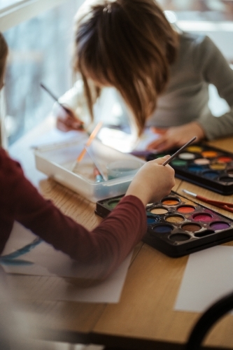 Girl painting with watercolour - Australian Stock Image