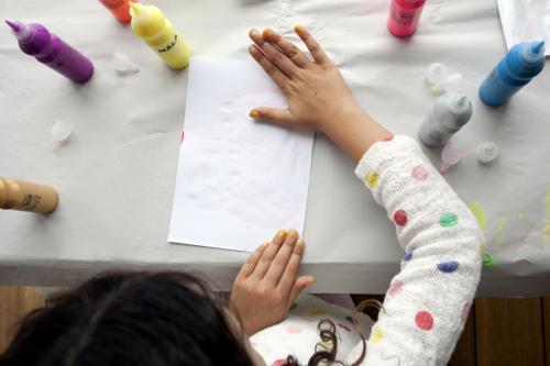 Girl playing with paints - Australian Stock Image