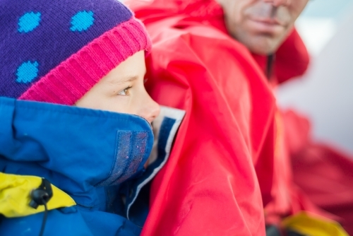 Girl rugged up warm in jacket with beanie - Australian Stock Image