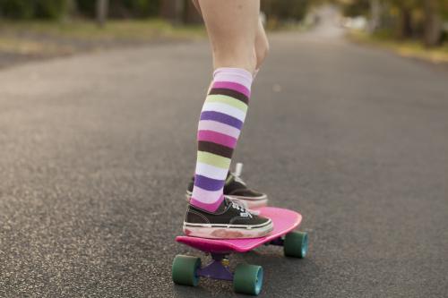 Girl skateboarding in a street