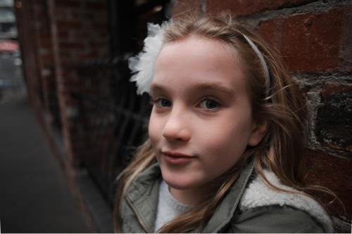 Girl standing in the street in winter - Australian Stock Image