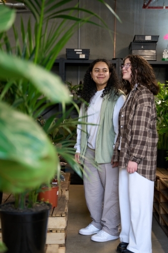 Girlfriends shopping for houseplants together - Australian Stock Image