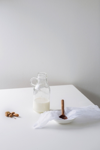 Glass bottle filled with nut milk