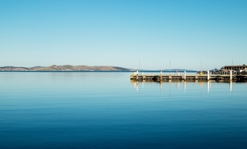 Glassy blue water in harbour - Australian Stock Image
