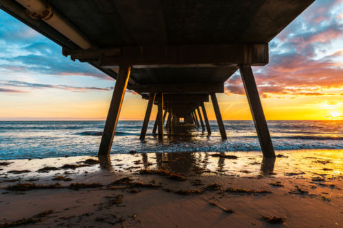 Glenelg Beach jetty at sunset - Australian Stock Image