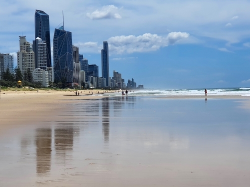 Gold Coast beach with city skyline in the background - Australian Stock Image