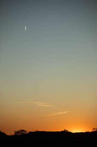 Golden sunset with short jet trail in a big sky - Australian Stock Image