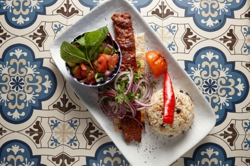 Gourmet Lebanese kebab and salad on plate - Australian Stock Image