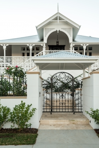Grand Queenslander home with large front gate - Australian Stock Image