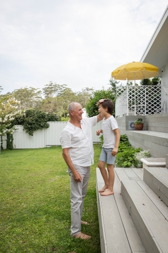 Grandad and grandson in backyard - Australian Stock Image