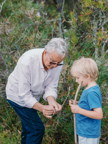 Grandfather exploring Australian Bushland with grandson - Australian Stock Image