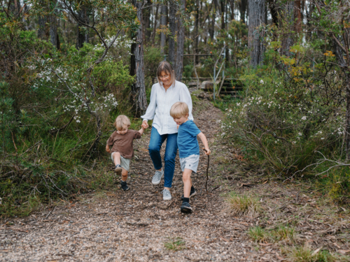 Grandmother enjoying Australian Bushland with her Grandchildren - Australian Stock Image