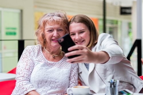 grandmother taking selfie with granddaughter - Australian Stock Image