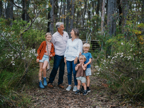 Grandparents enjoying Australian Bushland with their Grandchildren standing together for a portrait - Australian Stock Image