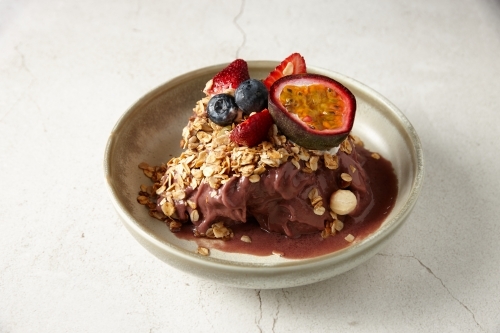 Granola cereal with fruit in bowl - Australian Stock Image