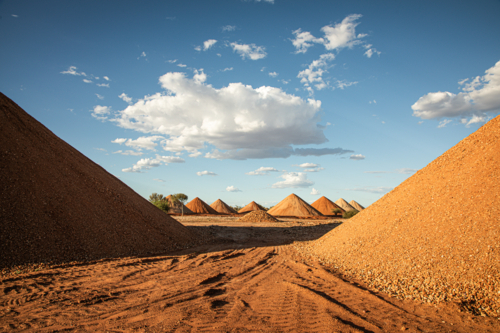 Gravel piles for building road base post flood damage - Australian Stock Image