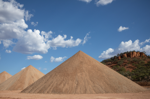 Gravel piles in front of a hill - Australian Stock Image