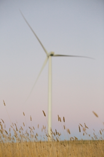 Green energy wind turbine in the countryside at dusk