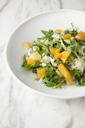 green salad with orange slices and grated cheese - Australian Stock Image
