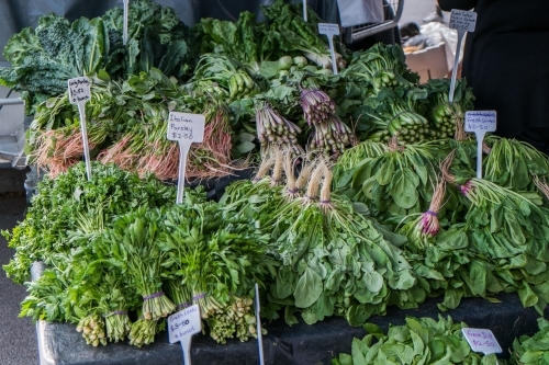 Green vegetables for sale at a market stall