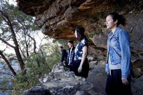 Group of friends on bush walk looking at scenery - Australian Stock Image