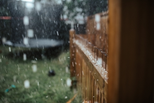 Hail and rain in a backyard