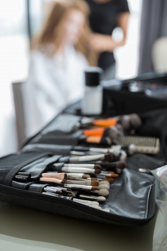Hair and makeup artist kit at pre-ceremony bridal preparations