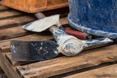 Hand tools lying on wooden pallet - Australian Stock Image