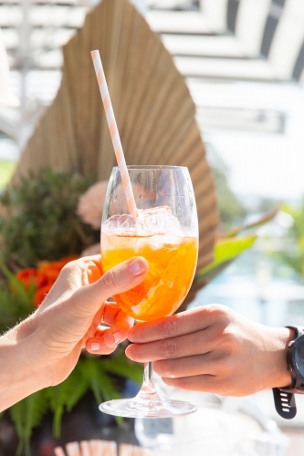Handing Over a Glass of Cocktail - Australian Stock Image