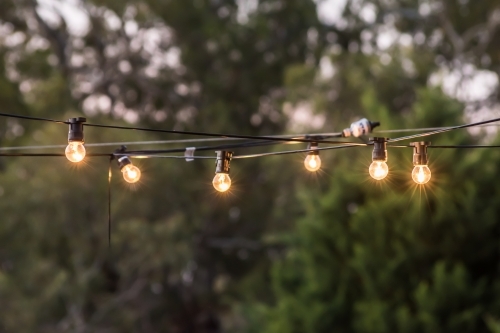 Hanging string lights outdoors