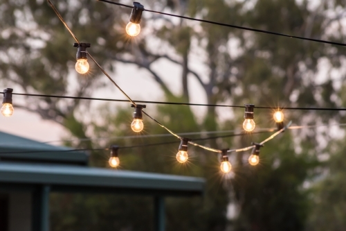 Hanging string lights outdoors