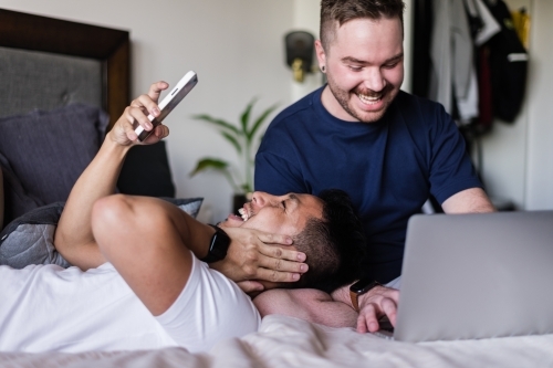 happy couple hanging out at home - Australian Stock Image