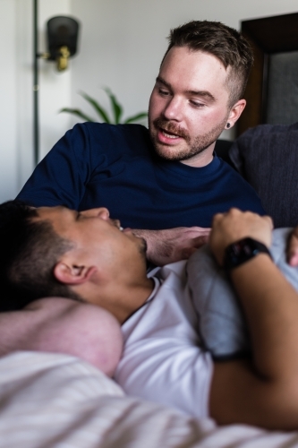 happy couple hanging out at home - Australian Stock Image