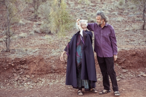 Happy elderly couple holding hands - Australian Stock Image