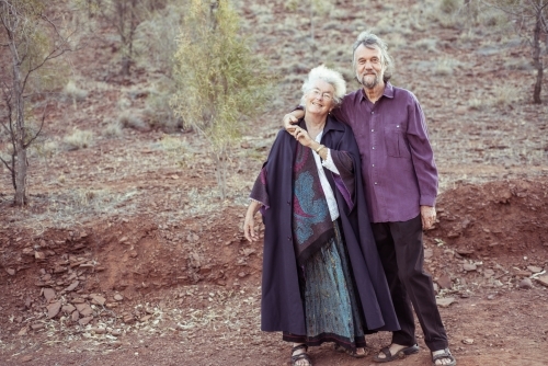 Happy elderly couple holding hands - Australian Stock Image