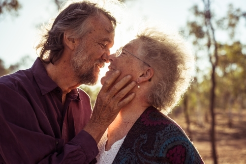 Happy elderly couple kiss in the Northern Territory