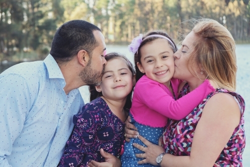 Happy multicultural family in the park - Australian Stock Image