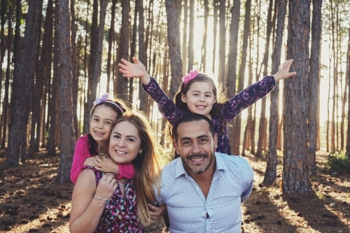 Happy multicultural family in the park - Australian Stock Image