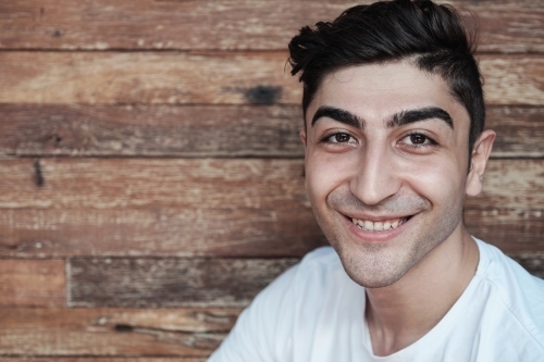 Happy multicultural young adult man, university student - Australian Stock Image