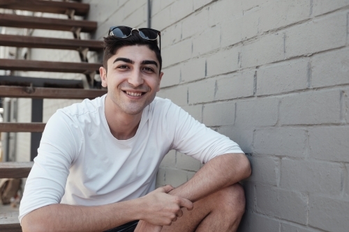 Happy multicultural young adult man, university student - Australian Stock Image