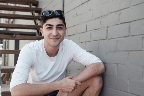 Happy multicultural young adult man, university student - Australian Stock Image