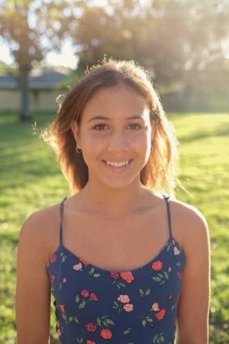 Happy multiethnic teenage girl in the park - Australian Stock Image
