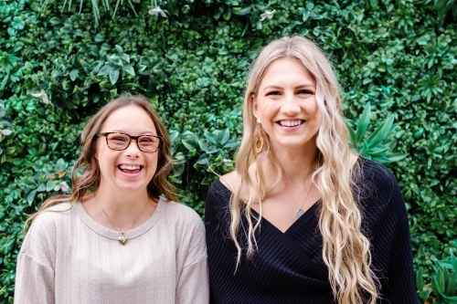 happy sisters, from a series featuring a woman with Down Syndrome - Australian Stock Image