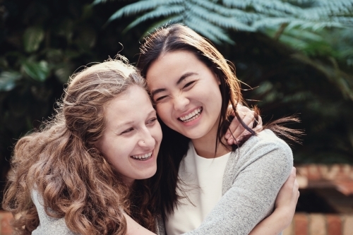 Happy students girl friends - Australian Stock Image