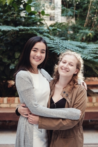 Happy students girl friends - Australian Stock Image
